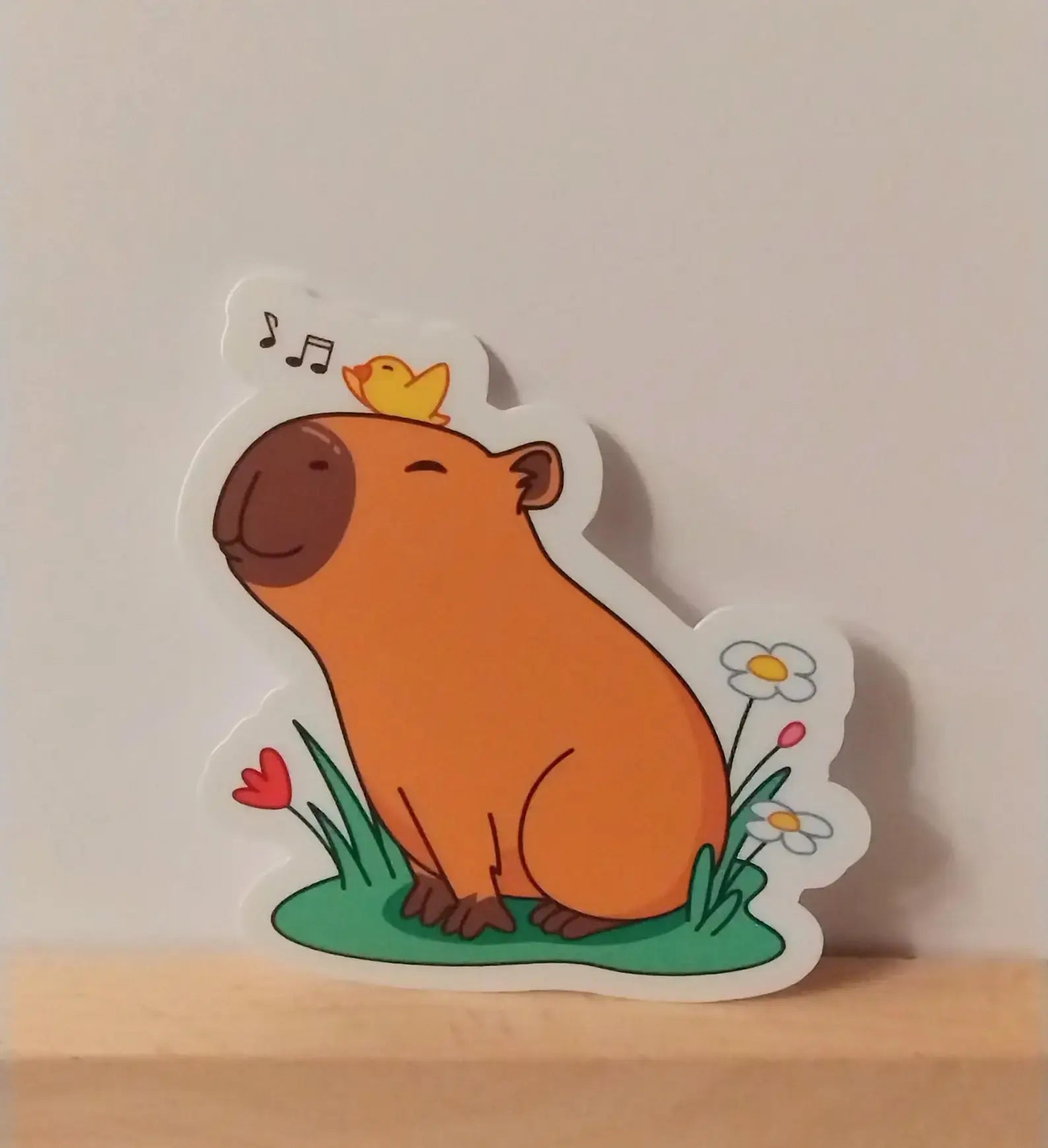 Adorable Capybara with Little Birdie Singing on Head Sticker